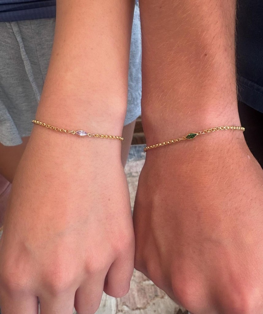 Two different wrists with matching gold bracelets