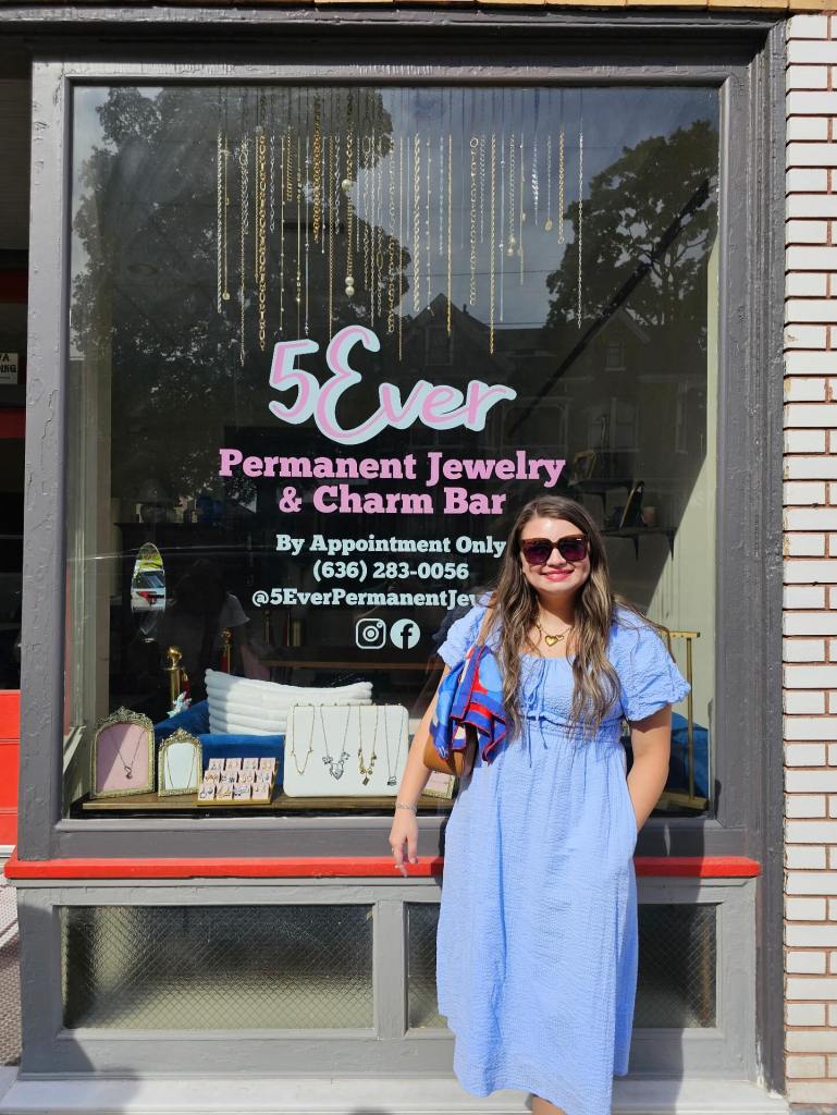 Holly Nelson standing in front of the 5Ever storefront