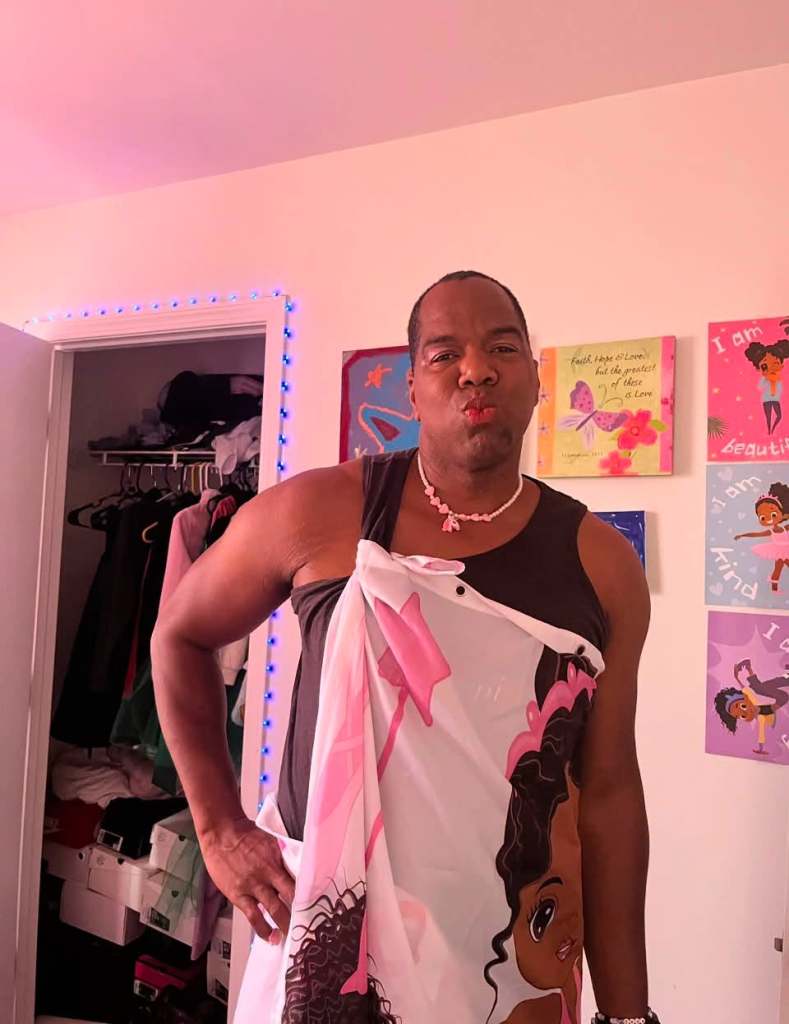 Food influencer KG posing with makeup and little girl's jewelry while playing dress up with his daughters