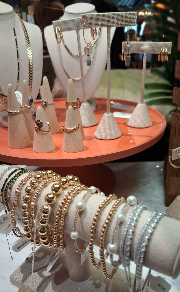 a display of bracelets and rings